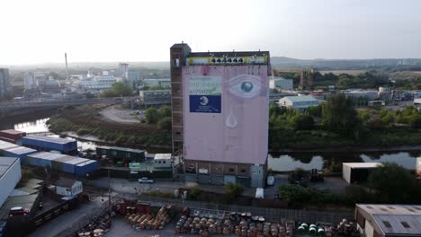 Iconic-Warrington-Pink-eye-Fairclough-Mill-self-storage-building-aerial-rising-forward-right-view