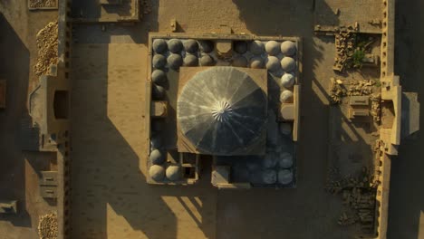 Aerial-Looking-Down-At-Dome-Roof-Of-Tomb-of-Isa-Khan-Tarkhan