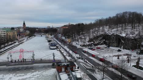 Aerial-view-of-cars-driving-slowly-in-city-center-with-flashing-lights-and-horns-blazing-protesting-against-high-fuel-prizes-at-gas-stations