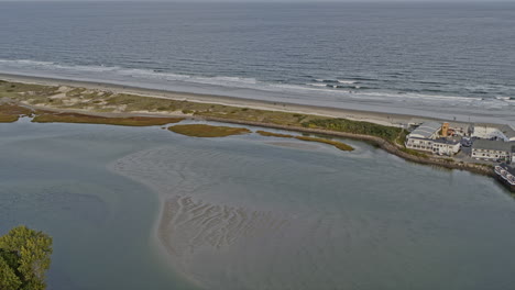 Ogunquit-Maine-Aerial-v8-birds-eye-view-drone-fly-around-river-inlet-capturing-beautiful-long-white-sand-beach-and-neighborhood-shingle-style-homes---Shot-with-Inspire-2,-X7-camera---October-2021