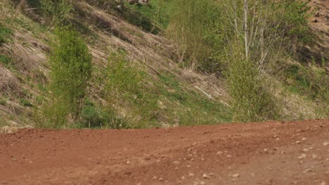 Car-buggy-competition-on-a-gravel-track,-fighting-for-the-first-place-by-participating-in-the-competition