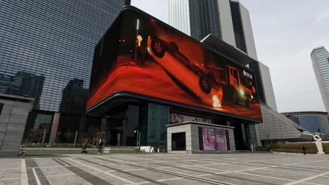 Entrance-to-the-Coex-Artium-complex-with-a-large-electronic-billboard-overhead-next-to-the-World-Trade-Center-in-Seoul,-South-Korea