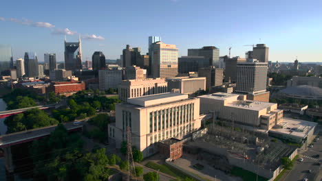 Aerial-view-around-the-north-side-of-the-Nashville-skyline,-in-sunny-USA---circling,-drone-shot