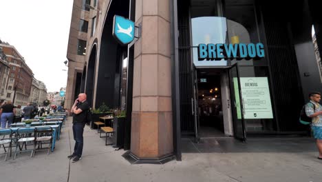 City-of-London-England-September-2022-Pan-left-establishing-shot-of-Brew-Dog-store-on-the-high-street