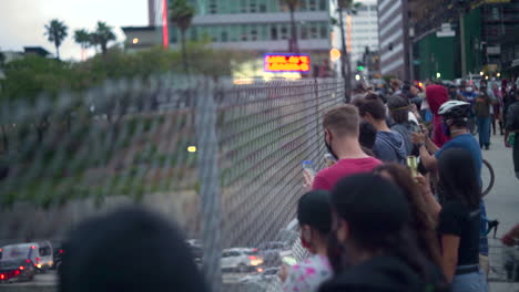 A-Crowd-of-BLM-protesters-watch-police-on-the-110-from-an-overpass-in-Downtown