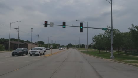 Traveling-in-the-Chicago-Illinois-area,-suburbs,-streets,-and-highways-in-POV-mode-us-30-near-Frankfort-Illinois-at-light