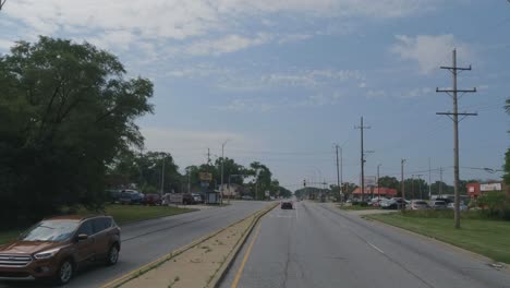 Traveling-in-the-Chicago-Illinois-area,-suburbs,-streets,-and-highways-in-POV-mode-stop-at-red-light-in-Glenwood-Illinois