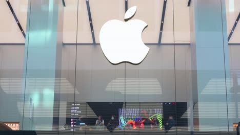 Shoppers-are-seen-at-the-multinational-American-technology-brand-Apple-store-and-logo-in-Hong-Kong