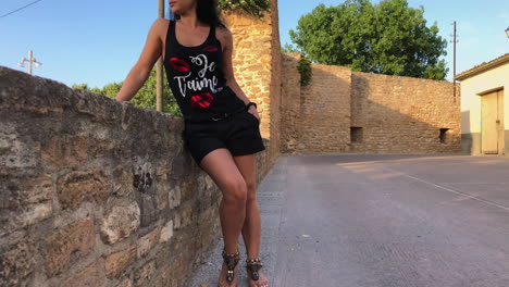 Woman-walking-through-the-streets-of-a-medieval-village