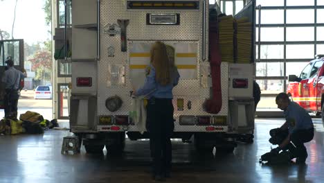 Firefighters-prep-gear-on-a-fire-truck-to-be-ready-for-emergency-response-and-firefighting