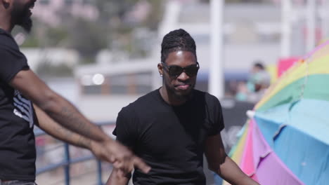 A-young-african-american-man-dancing-on-the-Santa-Monica-Pier-in-Los-Angeles