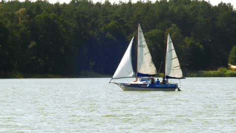 two-masted-Yacht-sailing-in-Wdzydze-Lake-in-Kaszubski-park-krajobrazowy-in-Pomeranian-Voivodeship