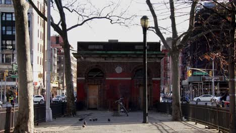 Brooklyn-street,-zoom-out-from-old-town-barn,-park