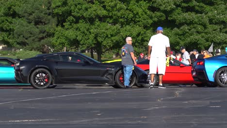 Two-men-discussing-their-cars-during-the-Corvette-Caravan-in-August-of-2019