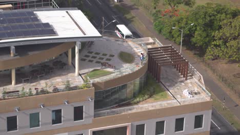 Female-Janitor-cleaning-on-a-rooftop