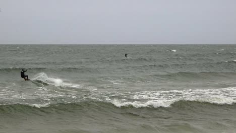 Two-men-kite-surfing-during-winter-on-Baltic-sea