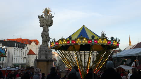 Time-lapse-video-of-Christmas-markets-in-foreground-a-children-attraction-in-form-of-an-illuminated-with-a-wave-of-people-walking-around-in-the-markets-Zeleny-Square-captured-at-4k-60fps-slow-motion