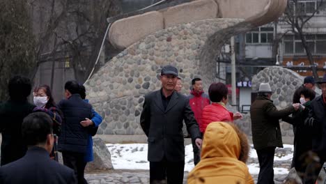 Mature,-happy,-Chinese-couples-dancing-in-park