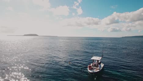 Anchored-Boat-and-People-in-Open-Sea