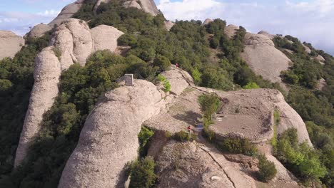 Marathon-runners-run-down-of-Montserrat-mountain,-Montserrat,-Spain