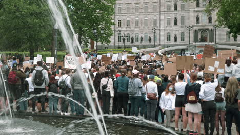 People-Protesting-Racial-Rights-During-BLM-Protest-In-Front-Of-The-Parliament-Building-In-Quebec,-Canada---panning-shot