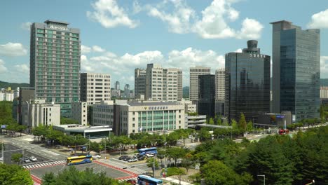 Daejeon-City-skyline-with-Traffic-Passing-By-High-rise-Buildings-And-Skyscrapers,-Police-Station-Building-At-Daytime-In-South-Korea