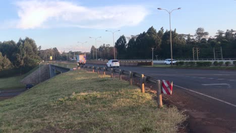 Road-traffic-on-highway-at-suburbs-of-Nairobi,-Kenya