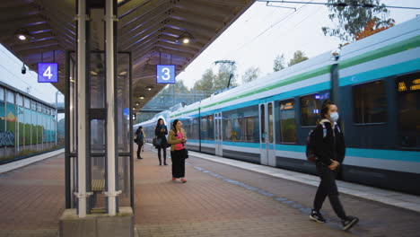 Passengers-social-distancing-as-they-enter-the-train-at-the-station