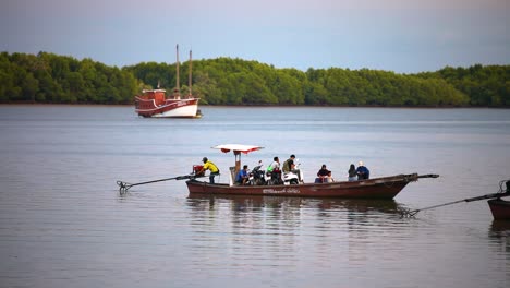 Local-People-on-a-Longtail-Boat-on-the-Pak-Nam-River-in-Krabi,-Thailand