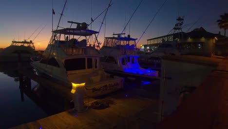 Looping---two-offshore-fishing-boats-in-harbor-at-sunset