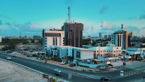 Cityscape-of-residential-buildings,-Helipad,-and-major-roads-during-sunrise