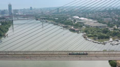 Aerial:-Belgrade-Marathon,-runners-crossing-bridge-in-city-centre