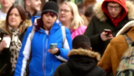 Crowd-of-Casual-multicultural-tourists-exploring-Manchester-city-streets-at-weekend