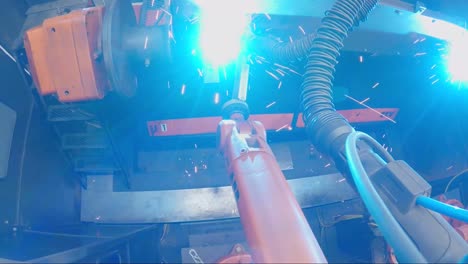 Robotic-Welder-Arm-In-A-Safety-Driven-Manufacturing-Factory-Machine-Shop-that-builds-steel-products-for-hitches-Stock-Video-Footage-#1
