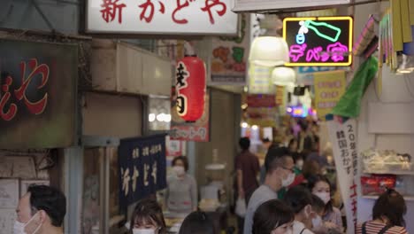 Busy-Tsuruhashi-Korea-Town-Market-in-Osaka-Japan,-Shopping-in-Tight-Street