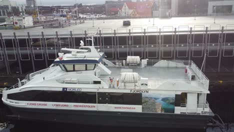 High-speed-passenger-boat-named-Fjordlyn-from-Norled-company-is-alongside-dock-in-Stavanger-Norway---Boat-used-for-sightseeing-and-cruise-to-pulpit-rock-Lysefjorden