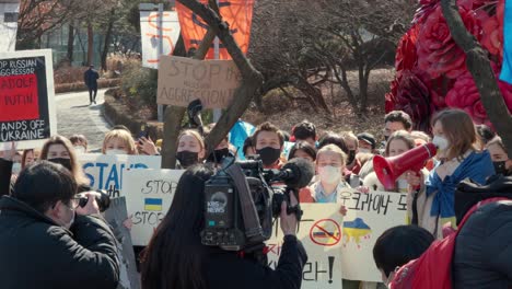 Ukrainians-living-in-Seoul-protesting-against-Russian-invasion-of-Ukraine-and-filmed-by-local-news