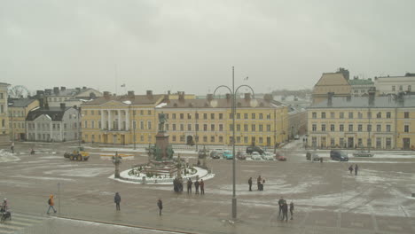 Snowplow-bulldozer-clear-the-snow-around-the-statue-of-Emperor-Alexander-II-in-front-of-Helsinki-Cathedral,-Senate-Square