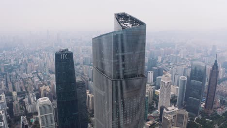 Guangzhou-Twin-Towers-towering-over-sprawling-port-city,-China