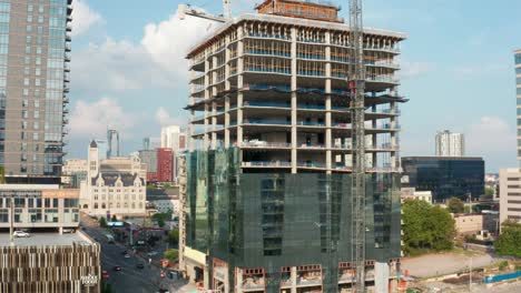 Rising-aerial-reveals-skyscraper-under-construction