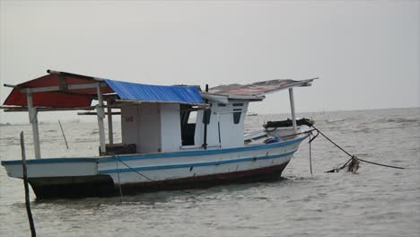 a-fishing-boat-moored-on-the-beach