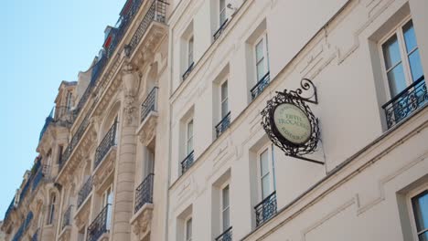 Closer-View-Of-Green-Hotel-Eiffel-Trocadero-Signage-During-Daytime-In-Paris,-France---high-angle-shot