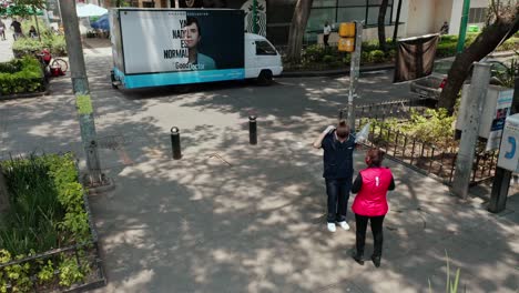 Aerial-above-shot-of-the-good-doctor-marketing-team-in-front-of-promotion-truck