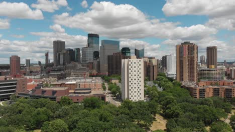 skyline-downtown-minneapolis-minnesota-buildings-towers-businesses-beautiful-blue-sky-summer-time-park-trees-aerial-drone