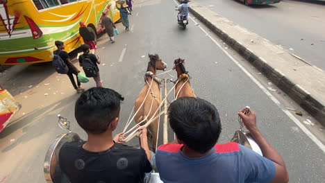 driver-having-a-conversation-on-rickshaw-while-riding-through-the-city