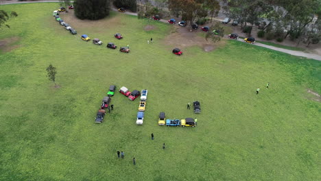 Moke-Owners-Association-50th-Anniversary-Convoy---Smooth-approach-toward-moke-owners-lining-up-to-be-positioned-into-word-sign-below