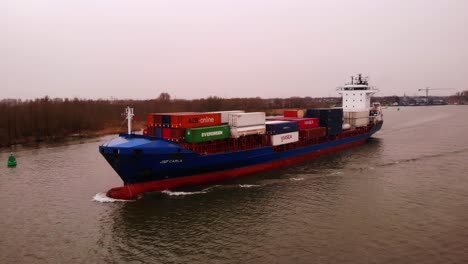 Aerial-Drone-View-Of-Forward-Bow-Of-JSP-Carla-On-River-On-Overcast-Day