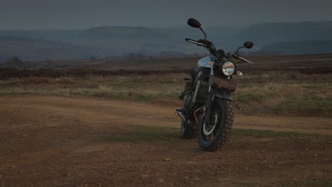 A-silver-Yamaha-XSR700-motorbike-shown-parked-at-sunset