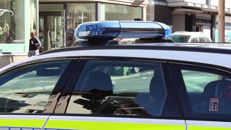 Blue-lights-flashing-on-top-of-a-German-police-vehicle-near-the-crime-scene-of-the-Mainz-shooting-in-March-2022