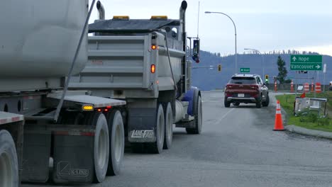 A-truck-slowing-down-for-a-police-road-stop-barricade